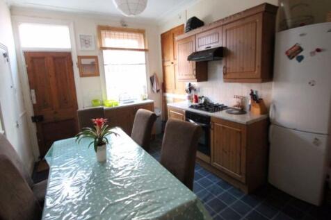 A well-maintained kitchen featuring wooden cabi...