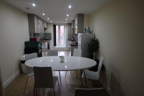 A modern, well-lit living room featuring a spac...