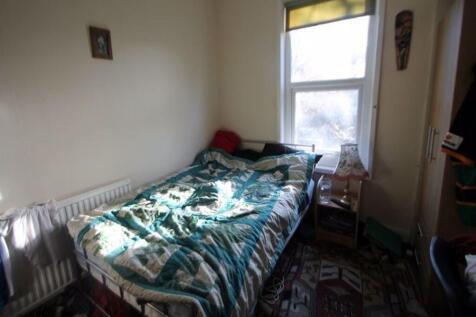 A cozy single bedroom with natural light stream...