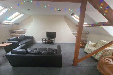 A spacious and inviting contemporary living roo...