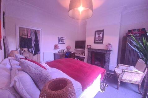 A spacious and well-maintained master bedroom f...