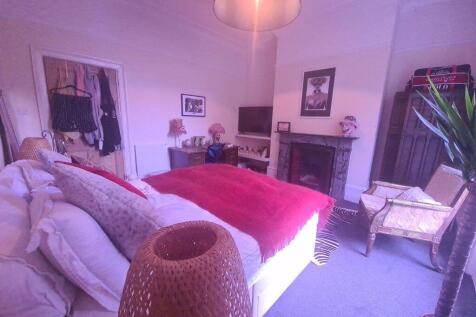 A spacious and inviting living room with ample ...