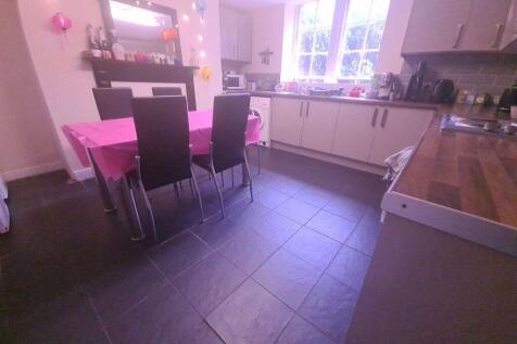 A bright, modern kitchen featuring ample counte...