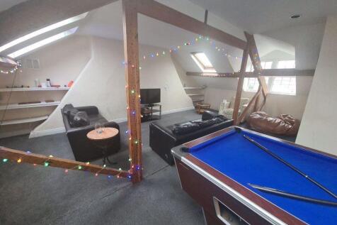 A spacious and modern living area featuring a b...