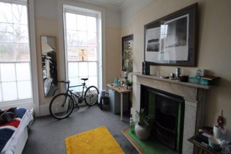 A bright and inviting living room with large wi...