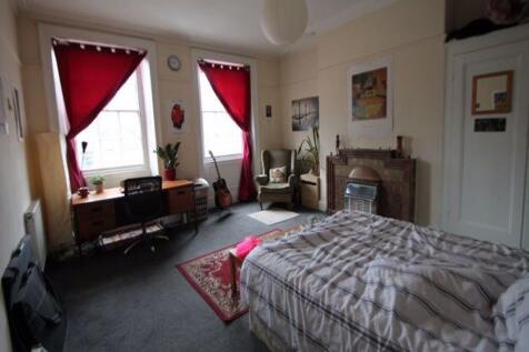 Bright and spacious master bedroom featuring a ...