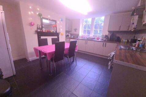 Bright and modern kitchen area with ample natur...