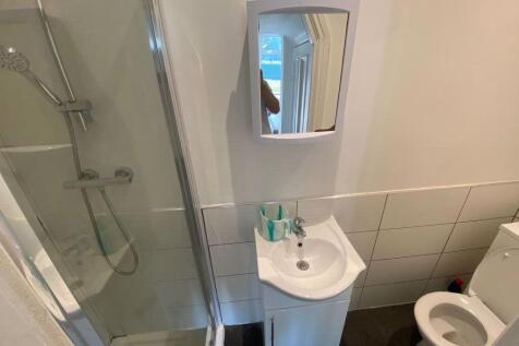 A clean and well-maintained bathroom with a spa...