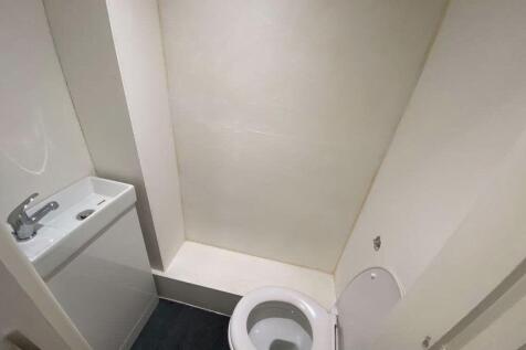 A clean and modern bathroom with a sizeable bat...