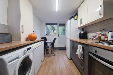 A bright, well-maintained kitchen featuring mod...