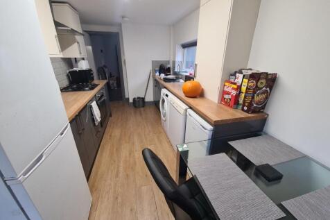 Bright and modern kitchen with ample counter sp...