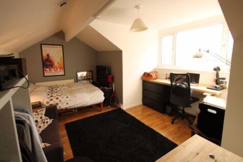 A bright and inviting double bedroom featuring ...