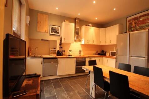 Bright and modern kitchen with ample counter sp...