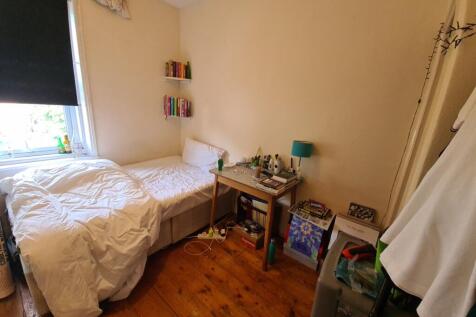 A welcoming master bedroom featuring a comforta...