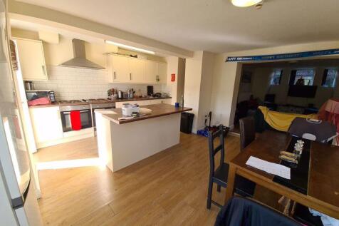 A spacious and welcoming living room featuring ...