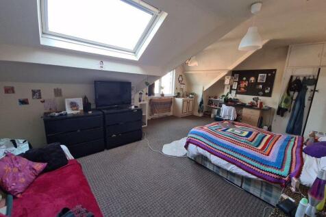 Bright and cozy living room featuring a large w...