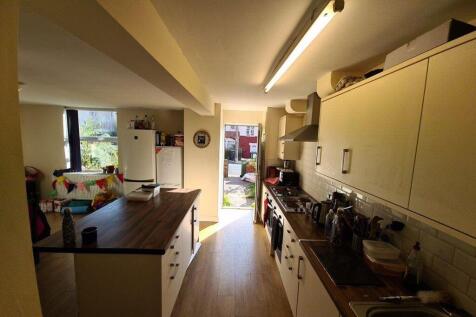 A bright and well-organized kitchen featuring m...