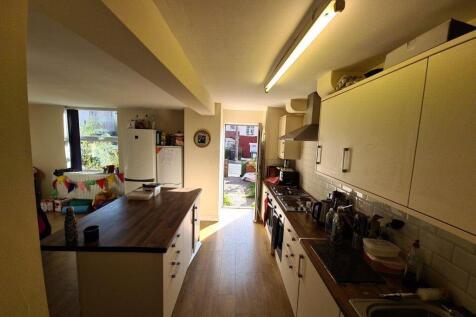 A bright and spacious living room with ample na...