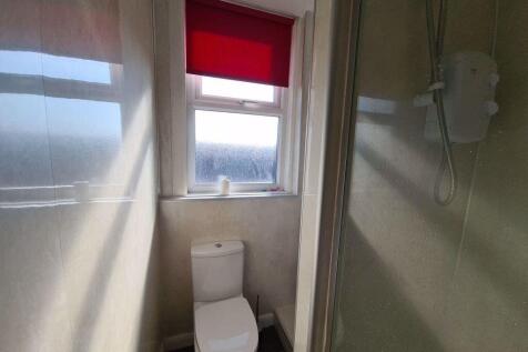 A clean, well-maintained bathroom featuring a w...