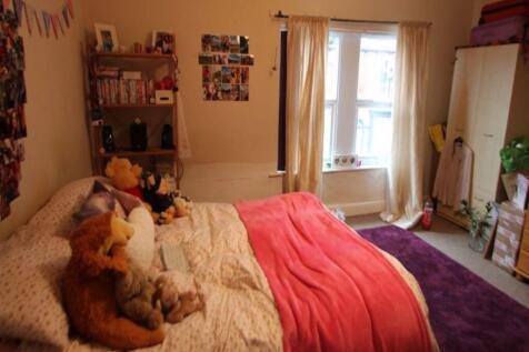 A bright and welcoming double bedroom featuring...