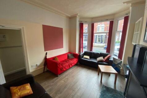 Bright and welcoming living room featuring a bo...