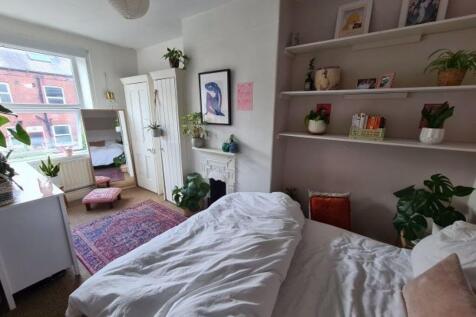 Bright and welcoming bedroom with ample natural...