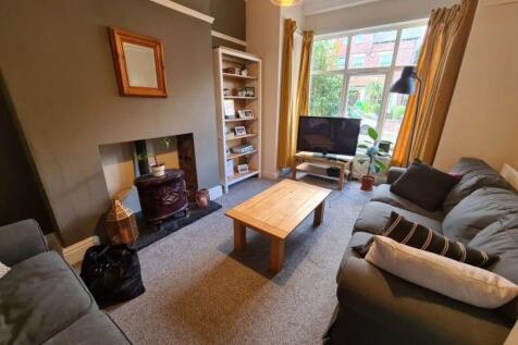 A bright, well-maintained living room featuring...