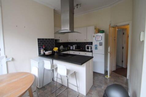 Bright and functional kitchen area featuring mo...