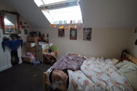 A cozy bedroom with a double bed and a window l...