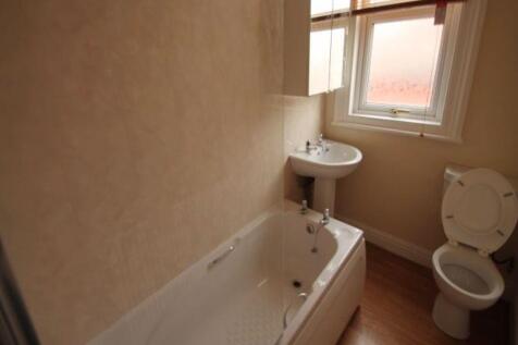 A clean and well-maintained bathroom featuring ...