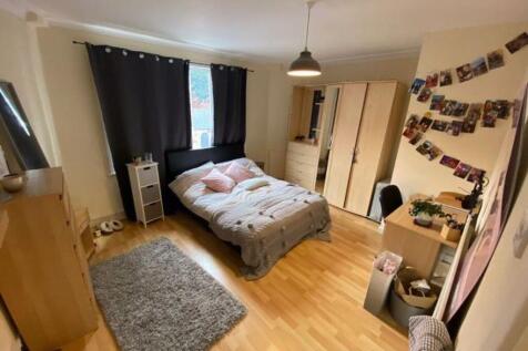 A cozy and well-maintained master bedroom featu...
