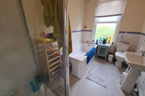 A bright and well-maintained bathroom featuring...