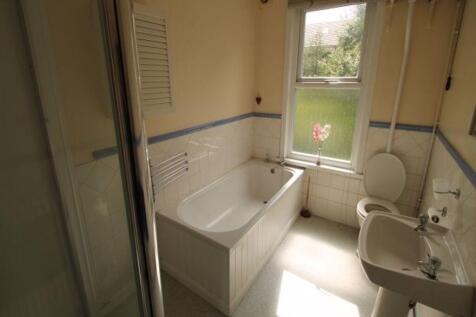 Bright and clean bathroom featuring a sizeable ...