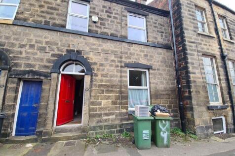 A charming stone-fronted house with a vibrant r...