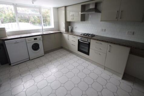 Bright and modern kitchen with ample counter sp...