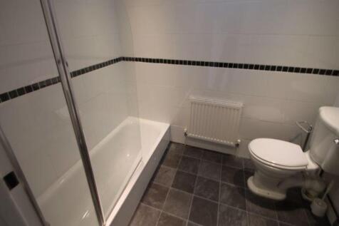 A clean and well-maintained bathroom featuring ...