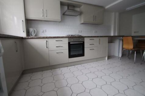 A modern, clean kitchen with ample storage cabi...