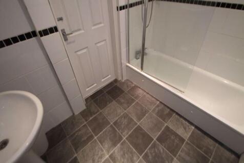 A clean, well-maintained bathroom featuring a b...