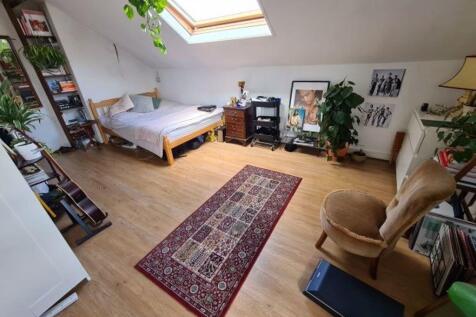 Bright and inviting living room with ample natu...