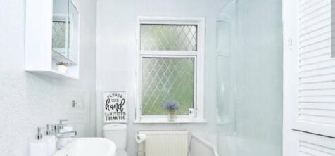 Bright and clean bathroom with modern fixtures ...