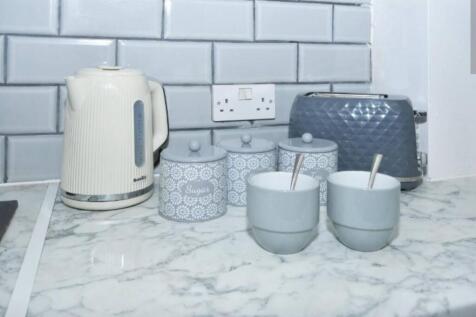 A neat and modern kitchen countertop featuring ...