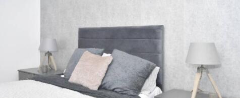 A modern double bedroom featuring a comfortable...