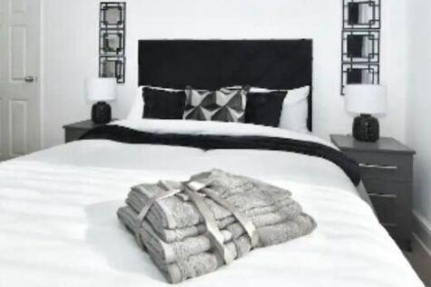 A well-presented master bedroom featuring a com...