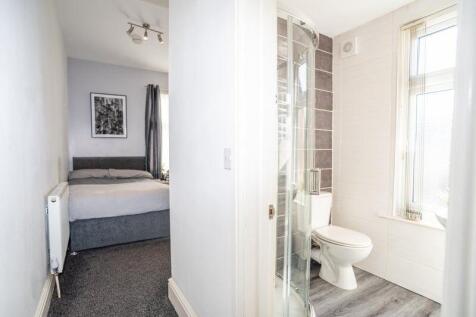 A bright and modern bathroom featuring a spacio...