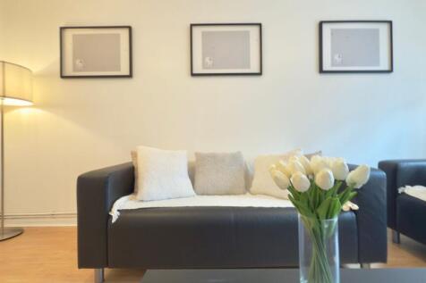 A stylish and inviting living room featuring a ...