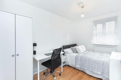 A bright and inviting double bedroom featuring ...