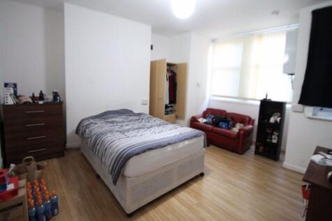 Bright and spacious master bedroom featuring a ...