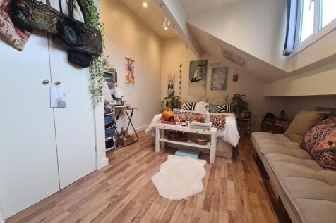 Bright and welcoming living room with natural l...