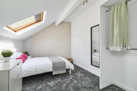 Bright and generously proportioned bedroom with...
