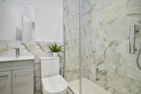 Bright and modern bathroom with a spacious show...